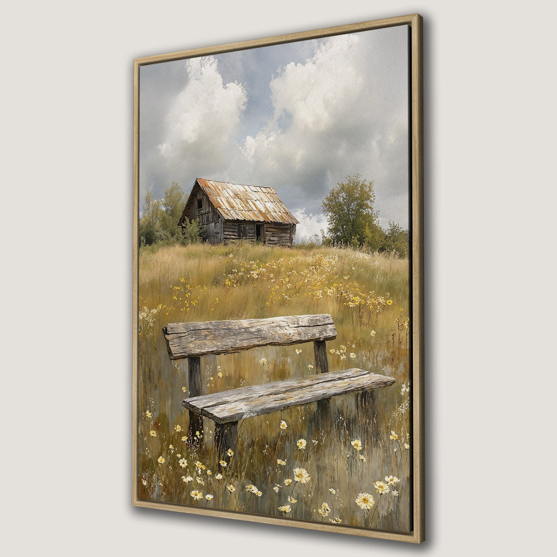 Framed Wall Art: Rustic landscape Canvas Print featuring a weathered bench, old barn, and wildflowers. Earthy tones and a serene, vintage aesthetic. Perfect for home decor.
