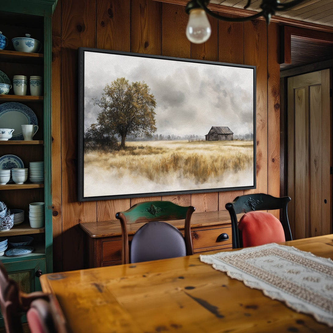 Framed Wall Art: Landscape Canvas Print with a tree and barn in a muted, neutral color palette. Rustic style adds warmth to any room.