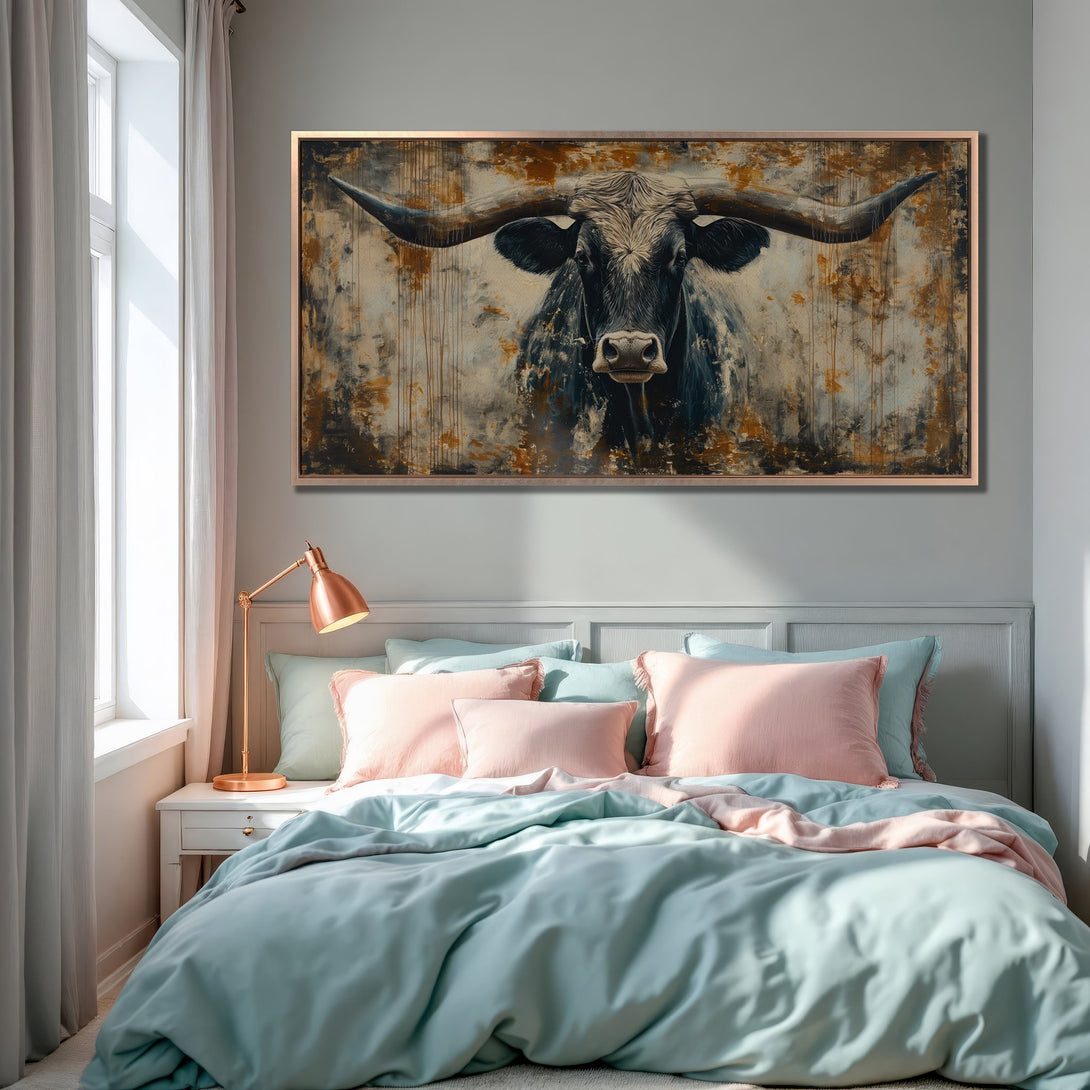 Framed Wall Art: Dramatic longhorn canvas print in a bedroom. Rustic style with a moody palette of blues, browns, and golds. Elevate your space!