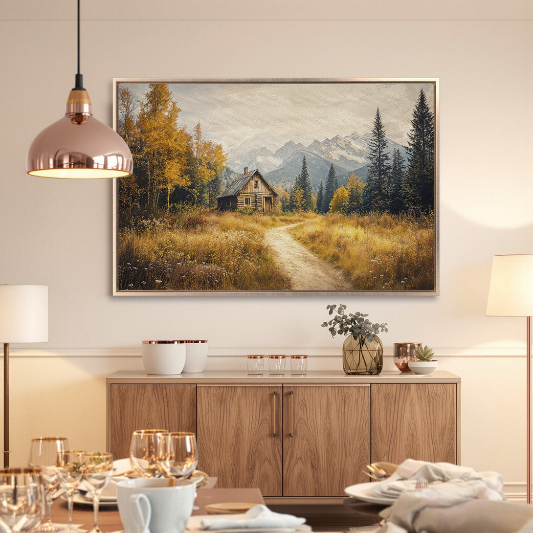 Framed Wall Art: Rustic cabin scene in warm gold and green tones. Bring the beauty of nature into your home with this stunning canvas print!