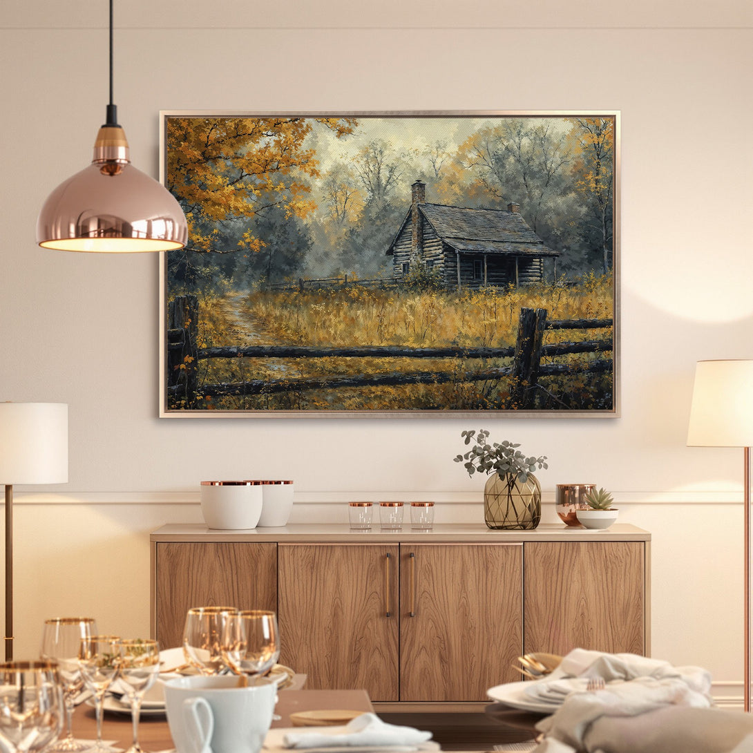Framed Wall Art featuring a rustic cabin scene with warm gold and gray tones. Perfect for adding a touch of nature-inspired art to your home decor.
