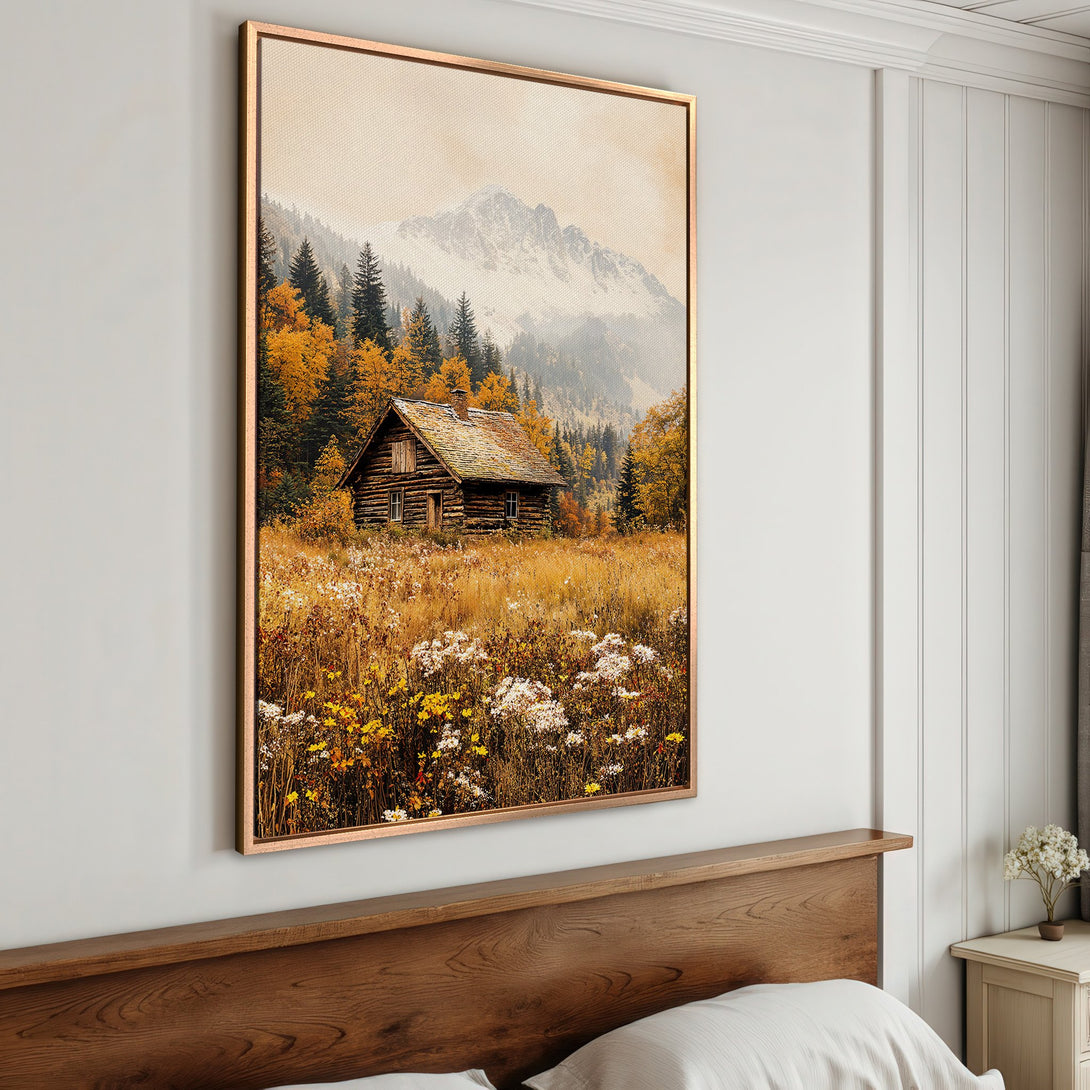 Framed Wall Art: Rustic cabin in a mountain landscape. Warm autumn colors of gold, brown, and green create a cozy, inviting feel. Perfect home decor.