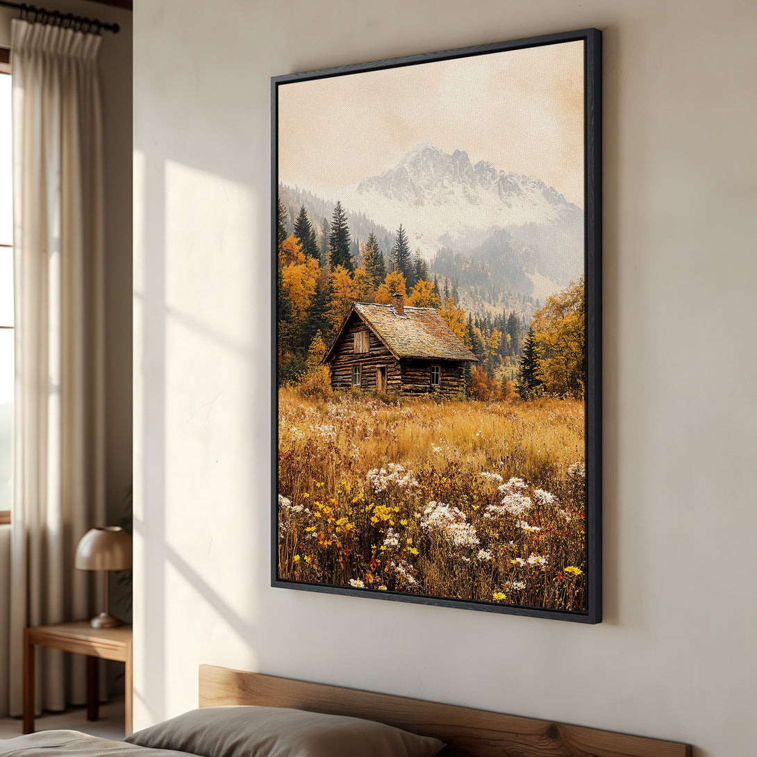 Framed Wall Art featuring a rustic cabin in a golden field with a mountain backdrop. Warm, earthy tones create a cozy, natural aesthetic.
