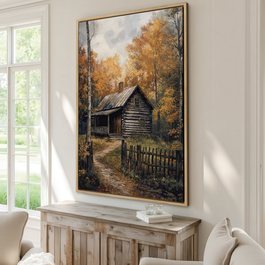 Framed Wall Art featuring a rustic cabin in an autumn forest. Warm, earthy tones of orange, brown, and green create a cozy, inviting atmosphere. Perfect for home decor.