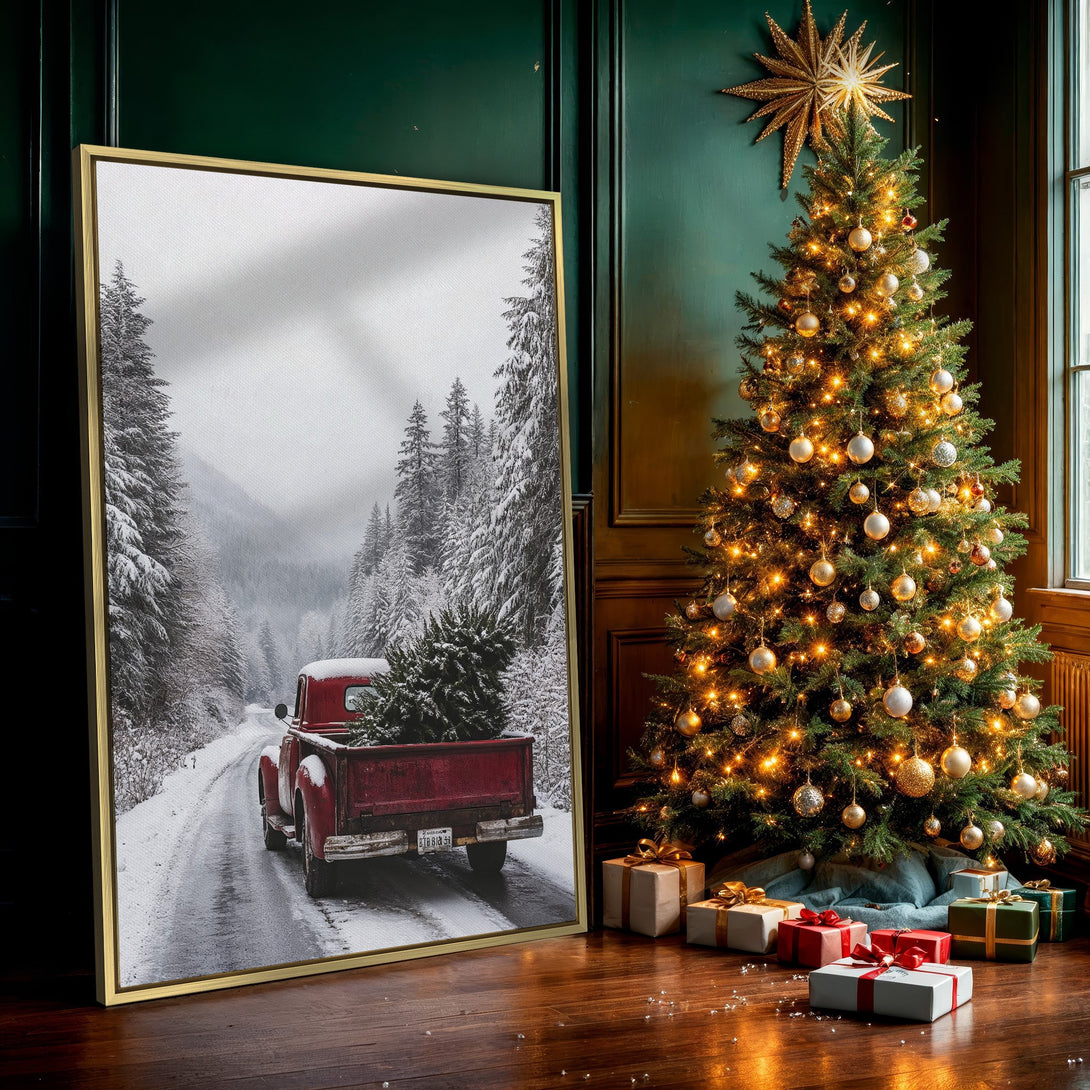 Canvas Print of a red vintage truck carrying a Christmas tree in a snowy forest. Rustic, winter scene in muted red, white, and gray tones.