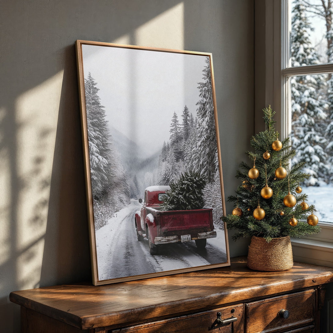 Framed Wall Art featuring a vintage red truck in a snowy winter scene. Rustic style with a grayscale and red color palette. Perfect for holiday decor!