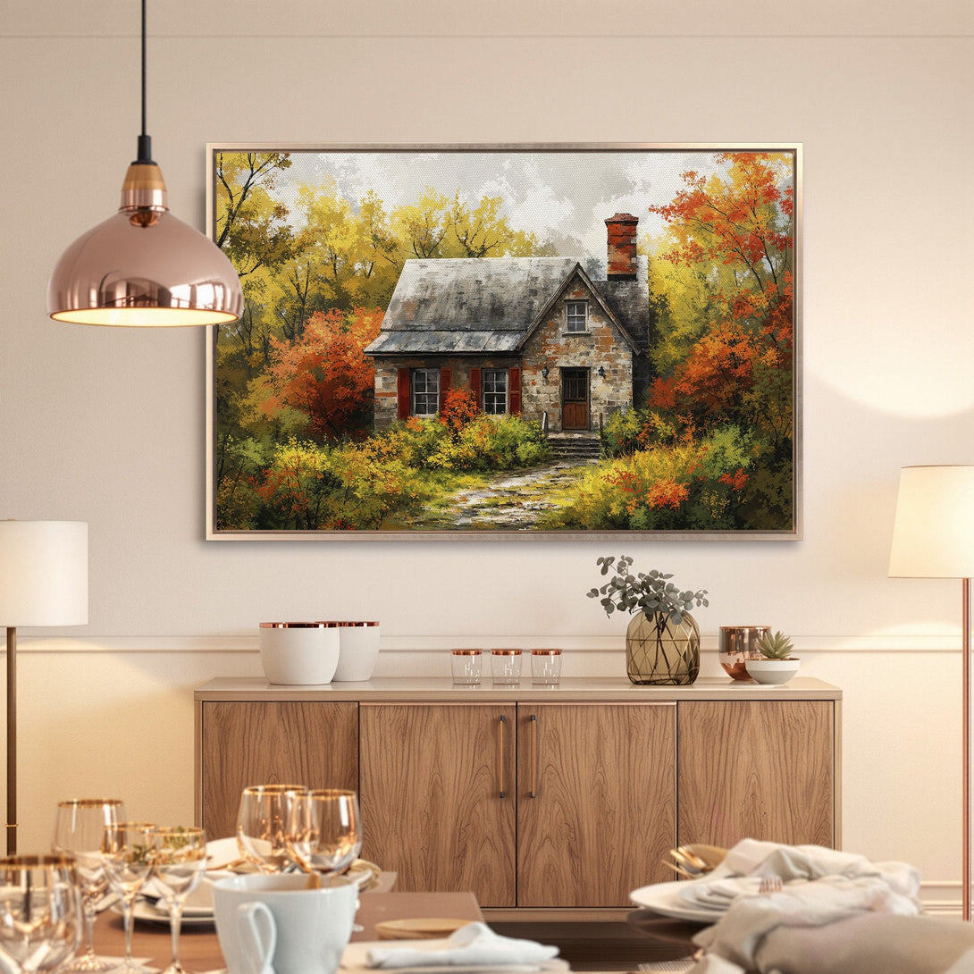 Framed Wall Art: Cozy cottage scene in autumn colors. Warm, inviting artwork with a rustic style, perfect for adding charm to your home.
