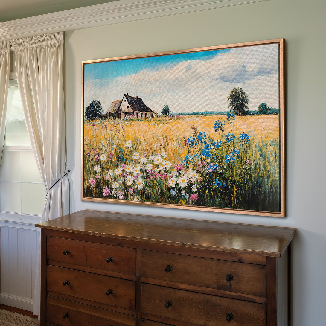 Framed Wall Art: Rustic landscape Canvas Print with wildflowers & barn, warm yellow, blue, and green color palette, perfect for farmhouse decor.