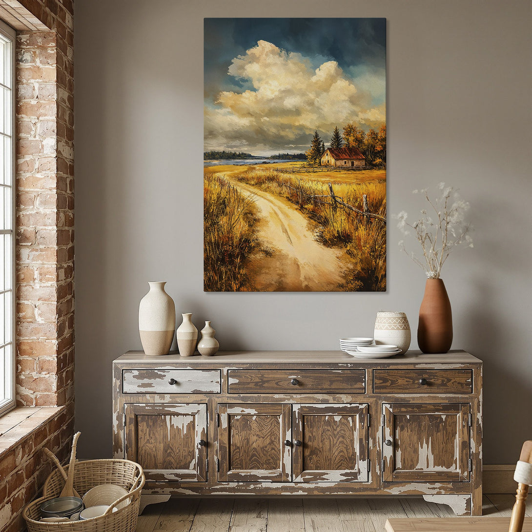 Framed Wall Art: Landscape Canvas Print with a warm, inviting color palette. Features a road leading to a cozy farmhouse under a dramatic sky.