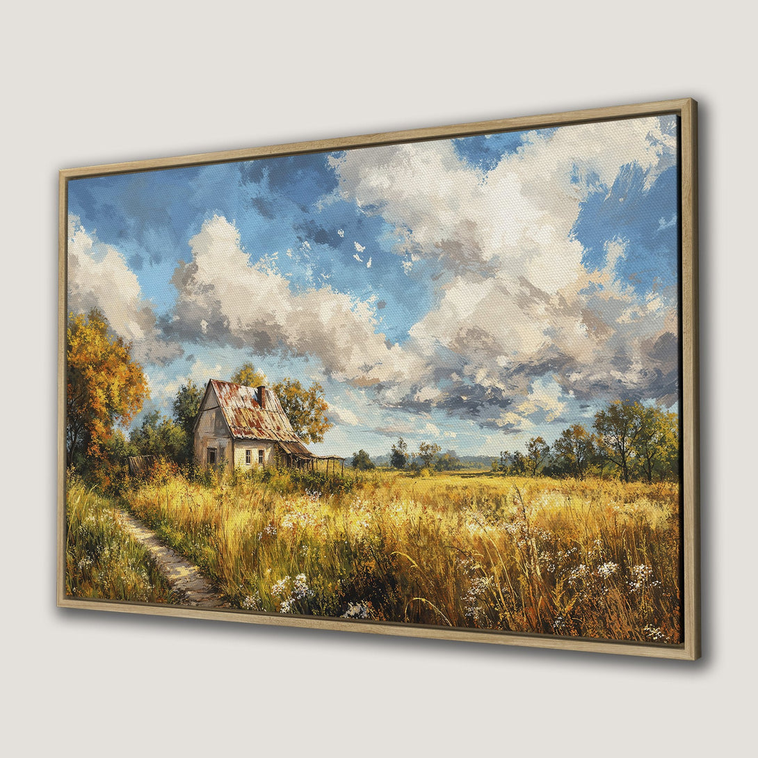 Framed Wall Art: Rustic landscape Canvas Print featuring a charming cottage, golden fields, and a vibrant blue sky. Warm, inviting color palette perfect for any room.