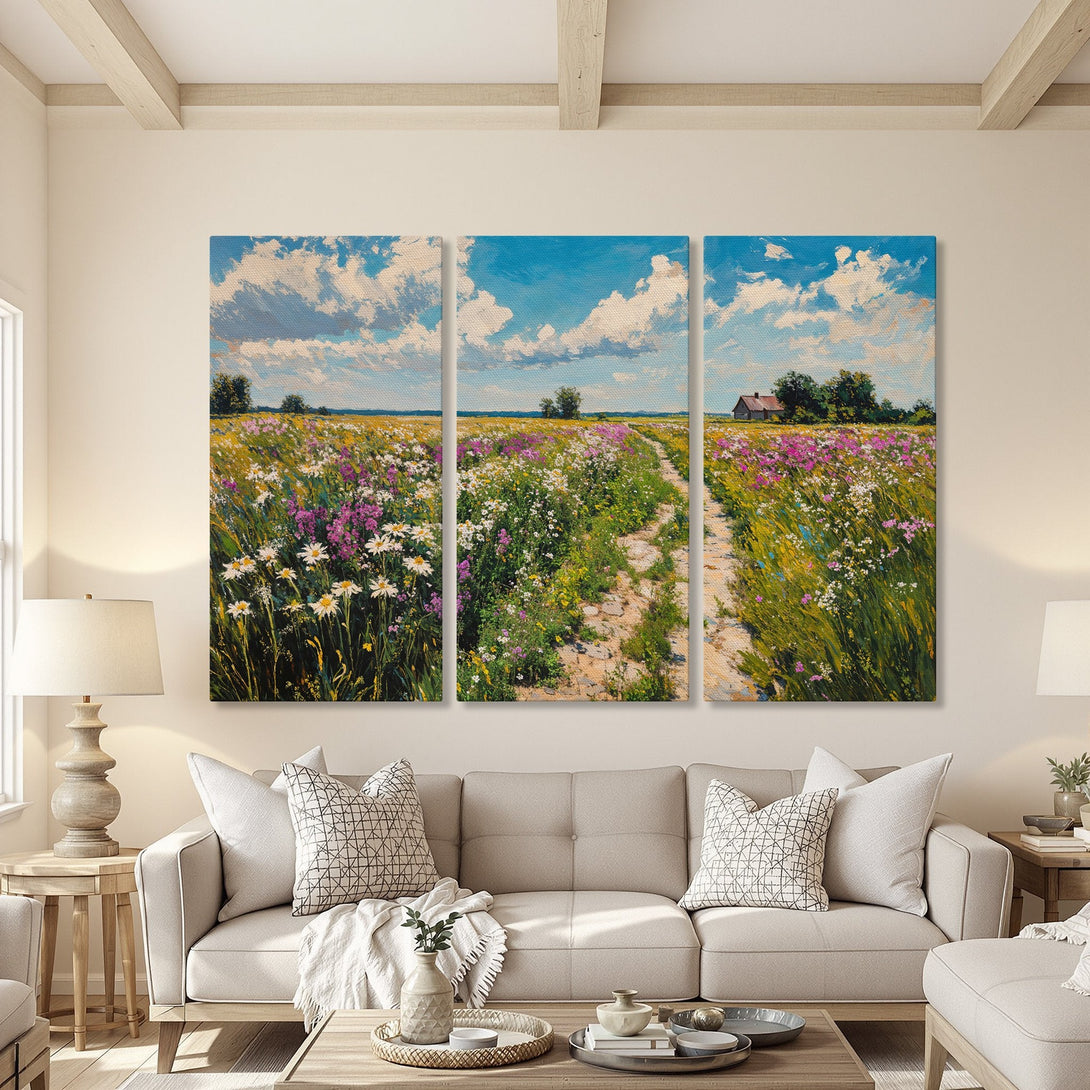 Canvas Print triptych of a vibrant wildflower field with blue skies. Impressionistic style, featuring a colorful palette of blues, greens, pinks, and yellows.