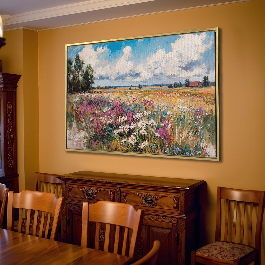 Canvas Print of a vibrant landscape painting with a blue sky and colorful wildflowers, displayed in a cozy living room.