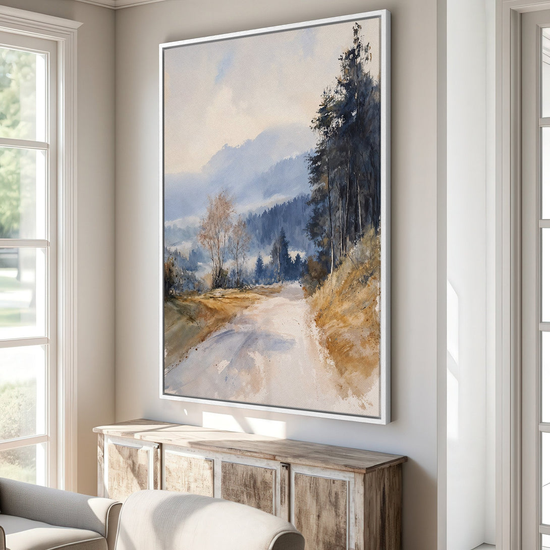 Framed Wall Art: Watercolor landscape Canvas Print with a road through misty mountains. Features a blue, beige, and brown color palette, perfect for any home.