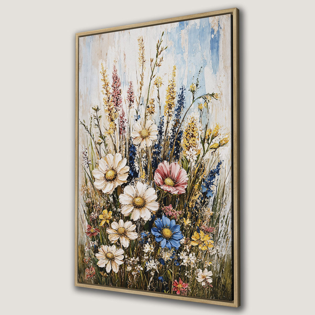 Framed Wall Art: Vibrant floral canvas print featuring wildflowers in a painterly style. Warm, natural color palette with pops of blue, yellow, and pink. Perfect wall decor.