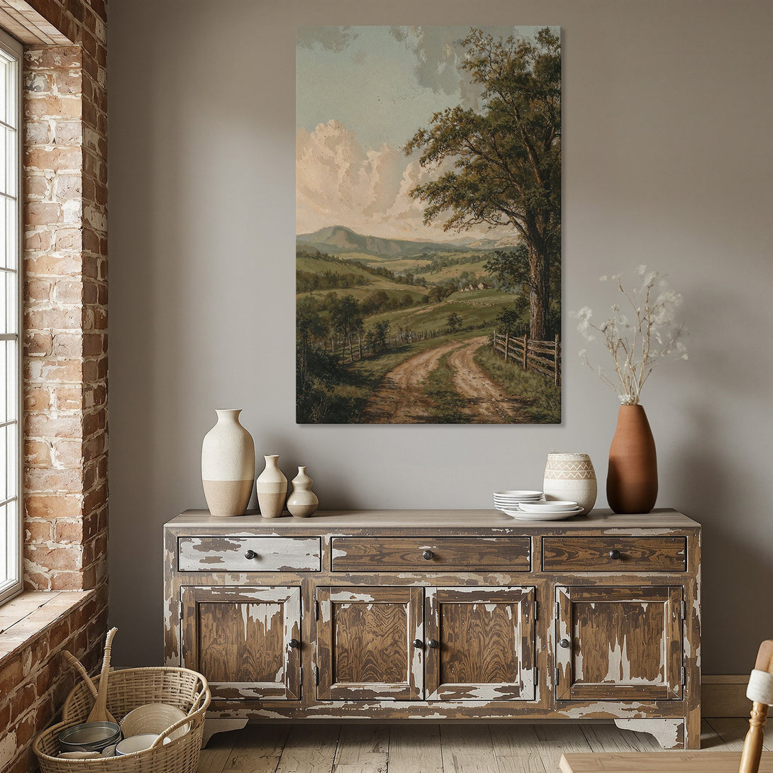 Framed Wall Art: Vintage landscape Canvas Print in a dining room. Featuring a dirt road, tree, and green fields, with a warm, neutral color palette.