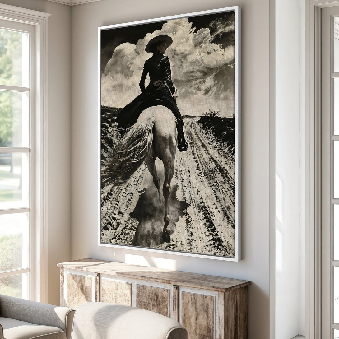 Framed Wall Art: Dramatic black and white canvas print of a woman on horseback. Vintage style with a neutral color palette, perfect for any space.