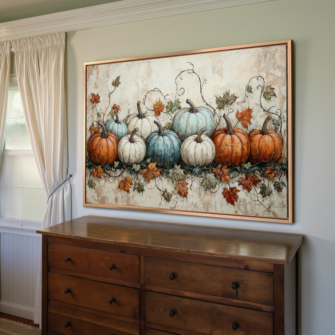 Framed Wall Art featuring a pumpkin still life in warm orange, blue, and cream tones. Rustic style canvas print perfect for fall decor.