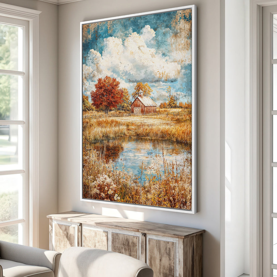 Framed Wall Art featuring a serene landscape with a barn, pond, and autumn foliage. Warm, inviting color palette with blues, browns, and golds. Perfect for home decor.