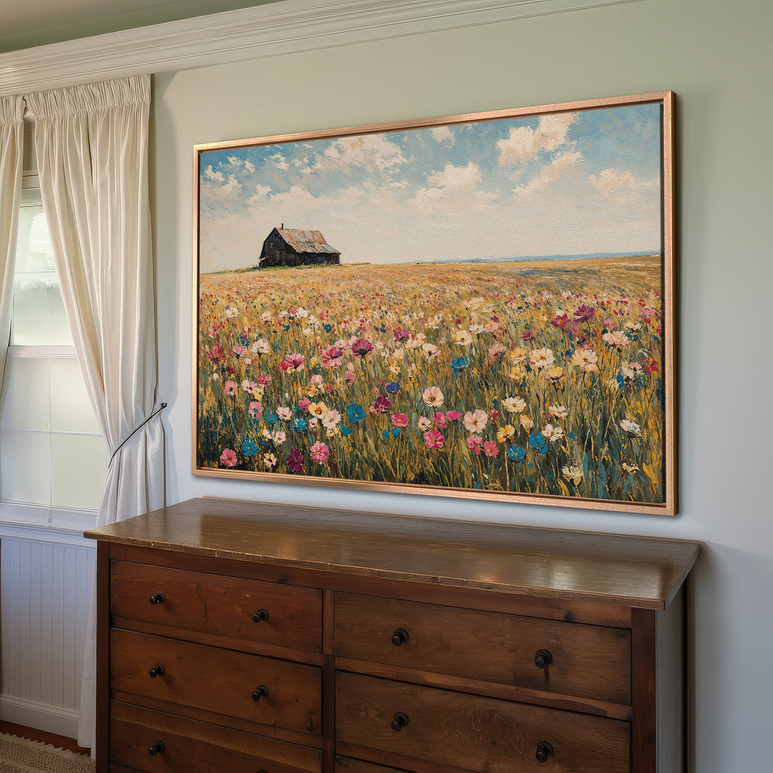 Framed Wall Art: Impressionist painting of a wildflower field with a barn, warm color palette, perfect for adding a touch of nature to your home.