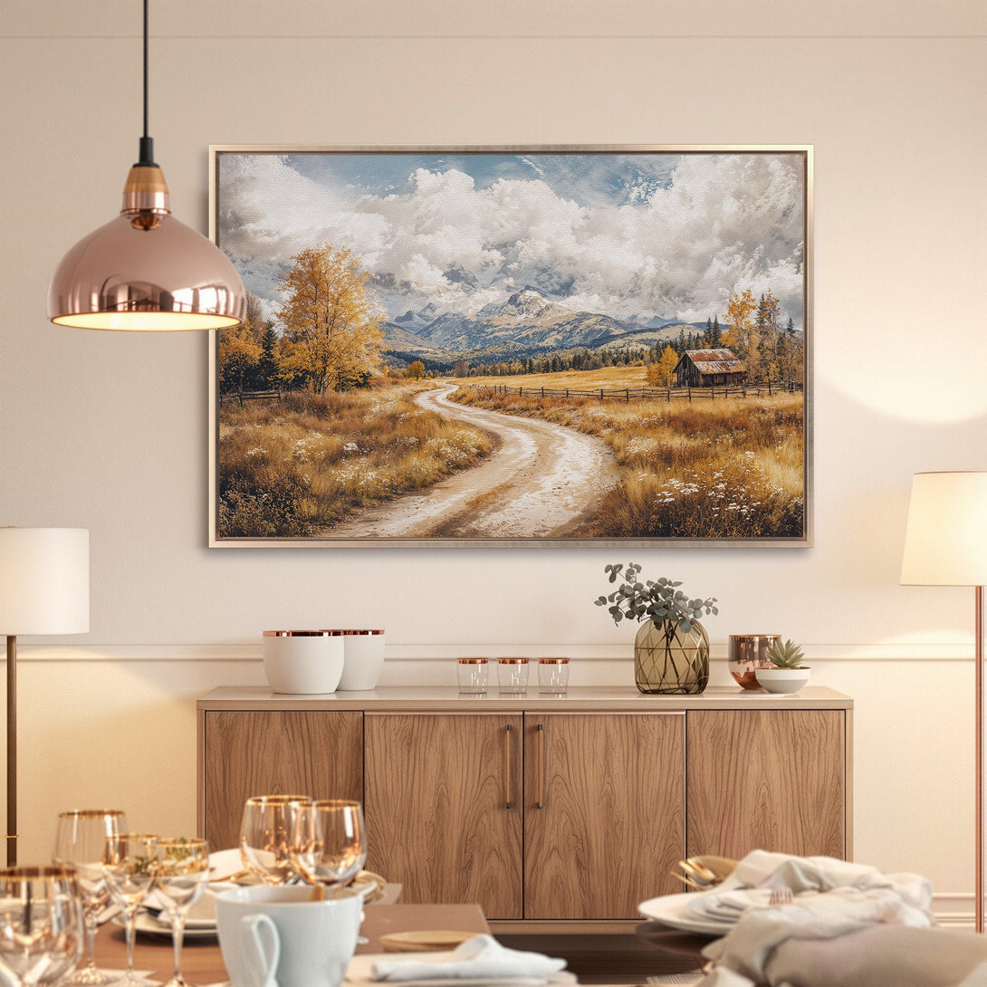 Framed Wall Art: Landscape Canvas Print of a winding road through a golden field, with mountains and a barn in a warm, neutral color palette.