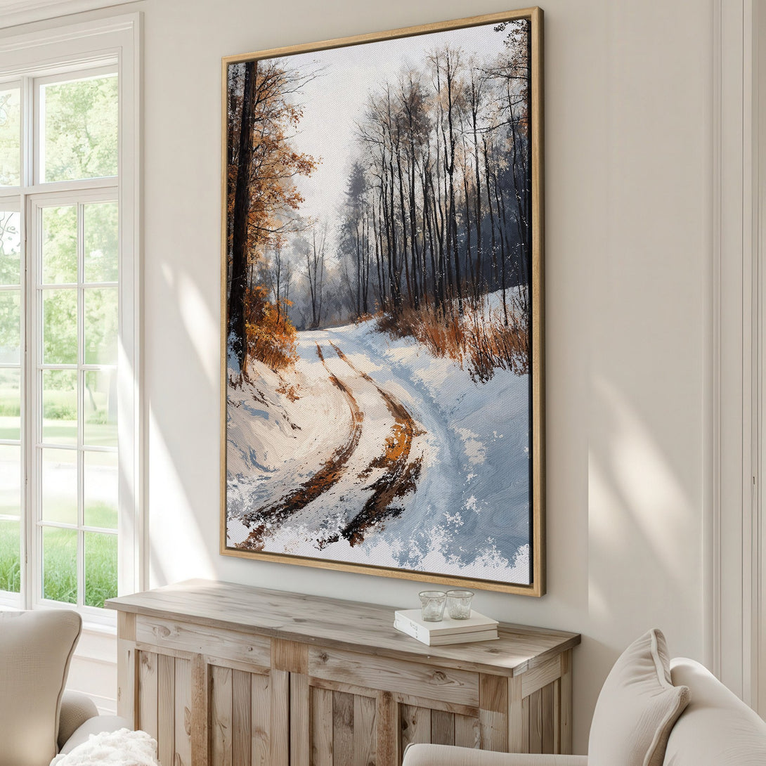 Framed Wall Art featuring a winter forest scene with a snow-covered path. Earthy tones of brown, white, and blue create a serene, natural aesthetic for any space.