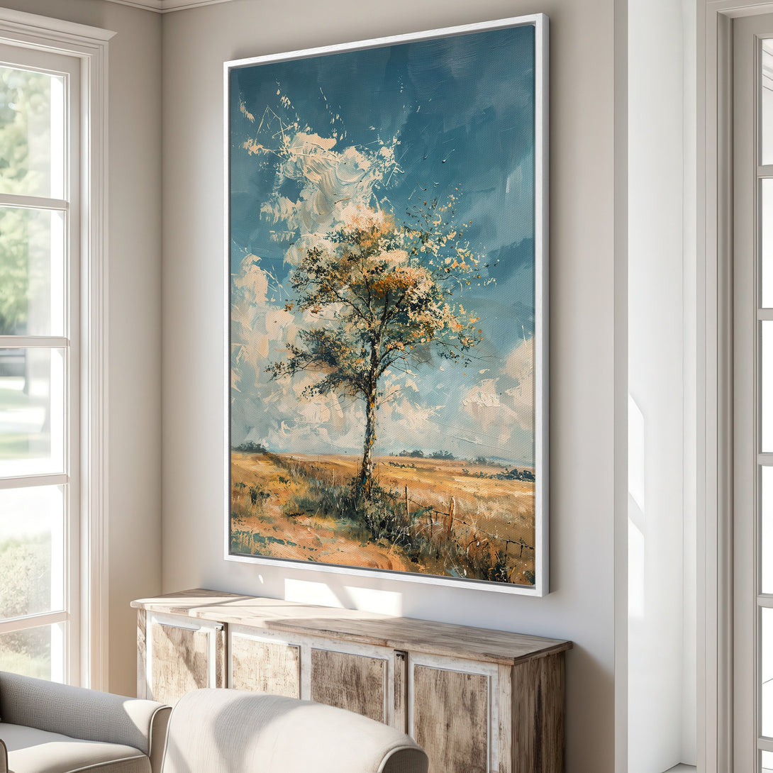 Framed Wall Art: Impressionist landscape Canvas Print of a tree in a field, featuring a blue, yellow, and brown color palette. Perfect for adding warmth to your home.