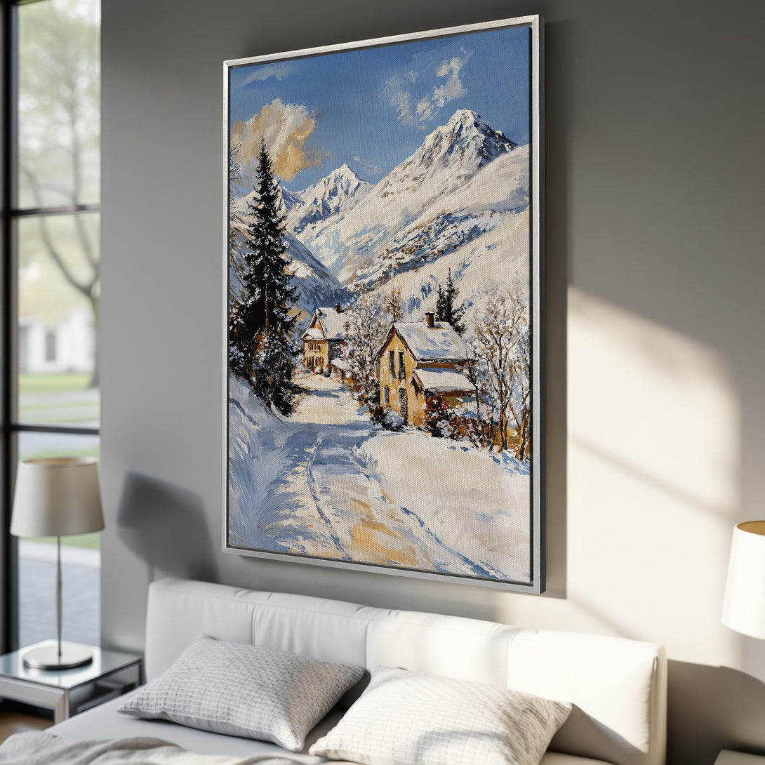 Framed Wall Art: Winter landscape Canvas Print in a bedroom. Features snowy mountains, blue sky, and warm-toned houses. Perfect for cozy decor!