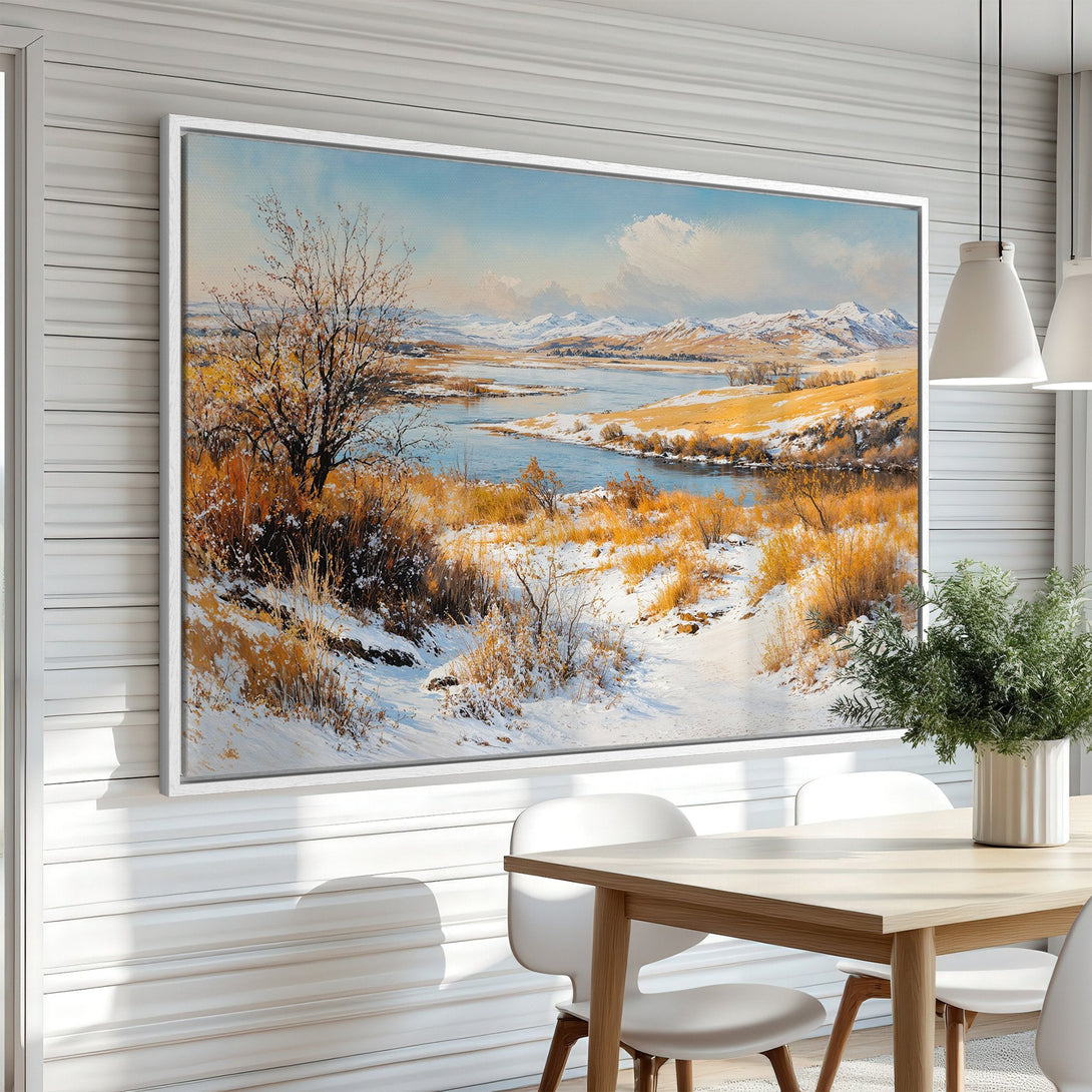 Framed Wall Art of a winter landscape with a river, featuring a warm color palette of gold, blue, and white. Perfect for adding a touch of nature to your home!