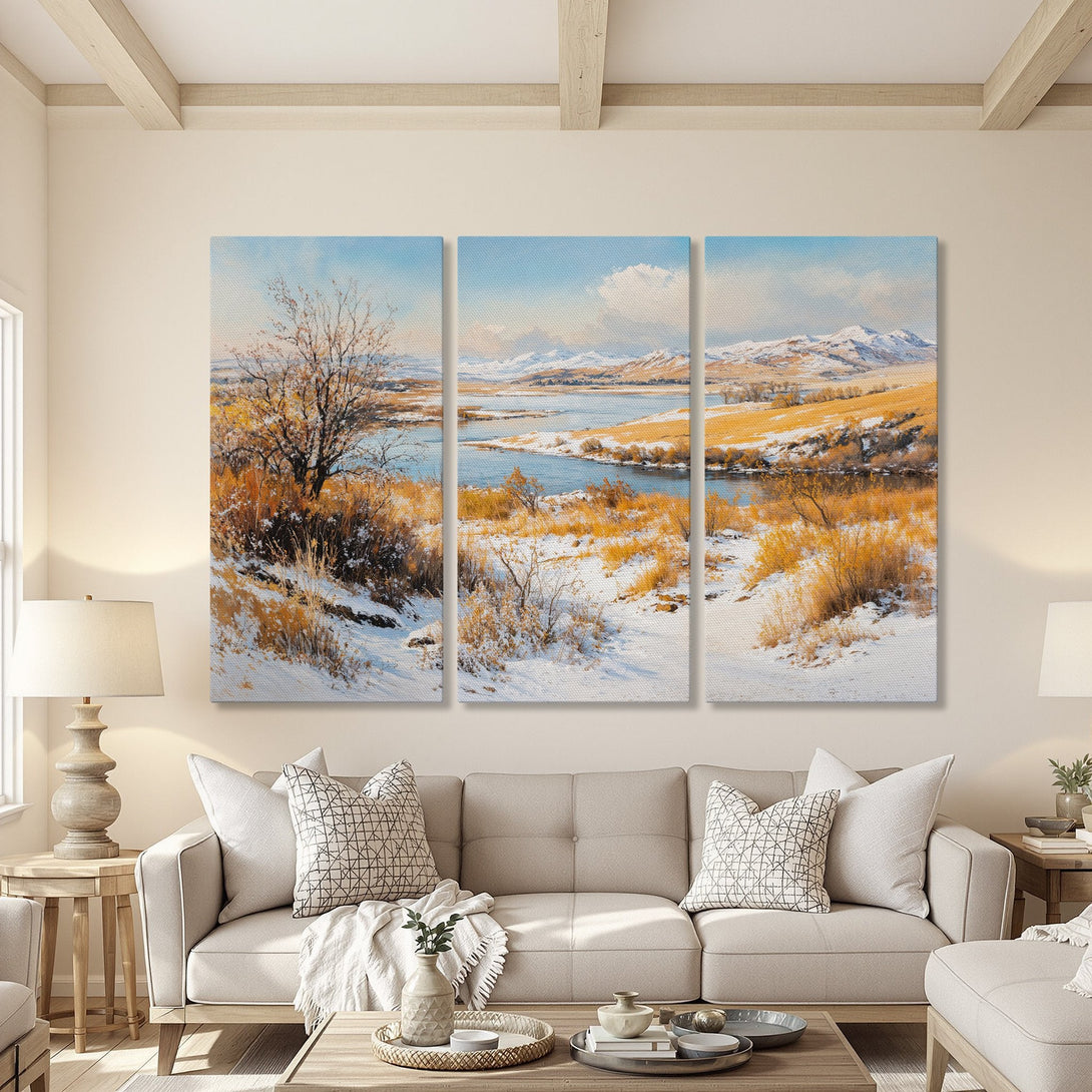 Canvas Print of a winter landscape in a living room. Featuring a serene scene with snow, trees, and mountains. Earthy tones and blue sky.