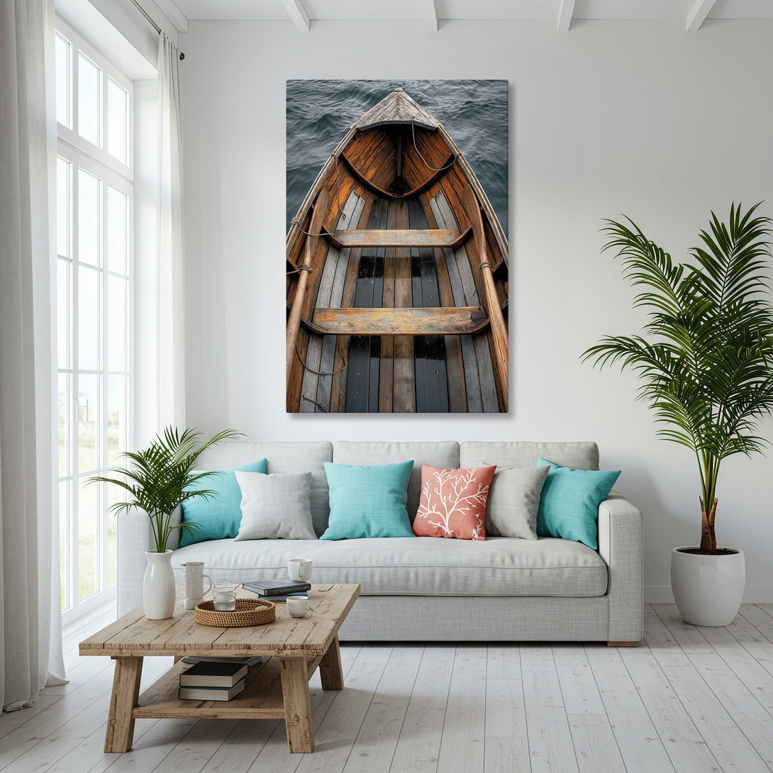 Framed Wall Art of a boat on the sea, in a coastal interior. Features a warm, rustic style with a blue and brown color palette. Perfect for your home!