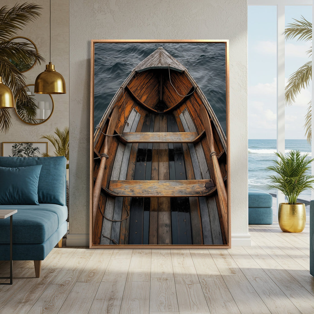 Framed Wall Art: Rustic wooden boat on the sea, displayed in a modern interior. Earthy tones of brown, gray, and blue create a calming coastal vibe.