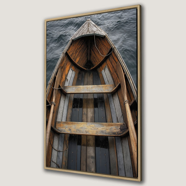 Framed Wall Art: Rustic wooden boat on water. Earthy tones of brown, grey, and black create a vintage, nautical aesthetic. Perfect for coastal decor.