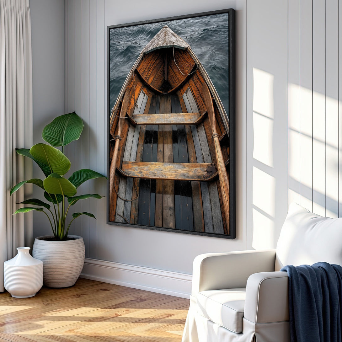 Framed Wall Art: Rustic wooden boat canvas print in a modern interior. Warm brown and gray tones create a cozy, inviting atmosphere. Perfect for coastal decor.