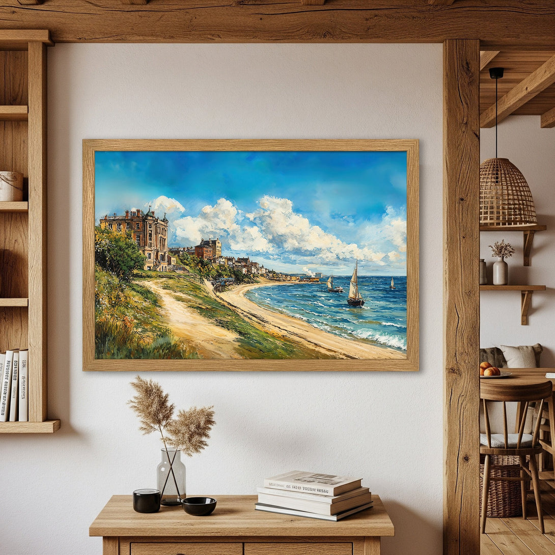 Framed Poster of a coastal landscape painting. Features a blue and white sky, beach, and buildings. Classic art style with a warm color palette.