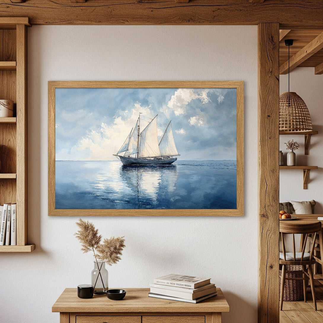 Framed Poster featuring a sailboat on the ocean, painted in a watercolor style with a blue and white color palette. Add coastal charm to your space!