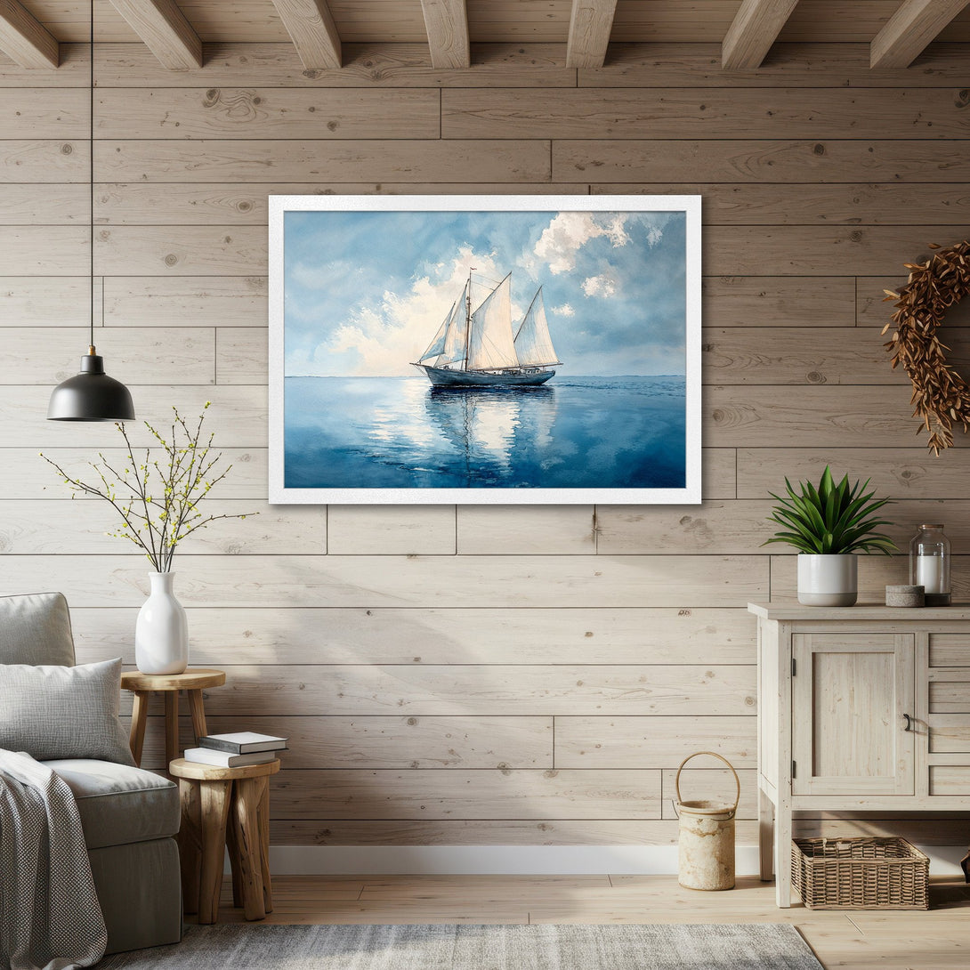 Framed Poster featuring a sailboat on the sea, painted in a watercolor style with a blue and white color palette. Perfect coastal decor!