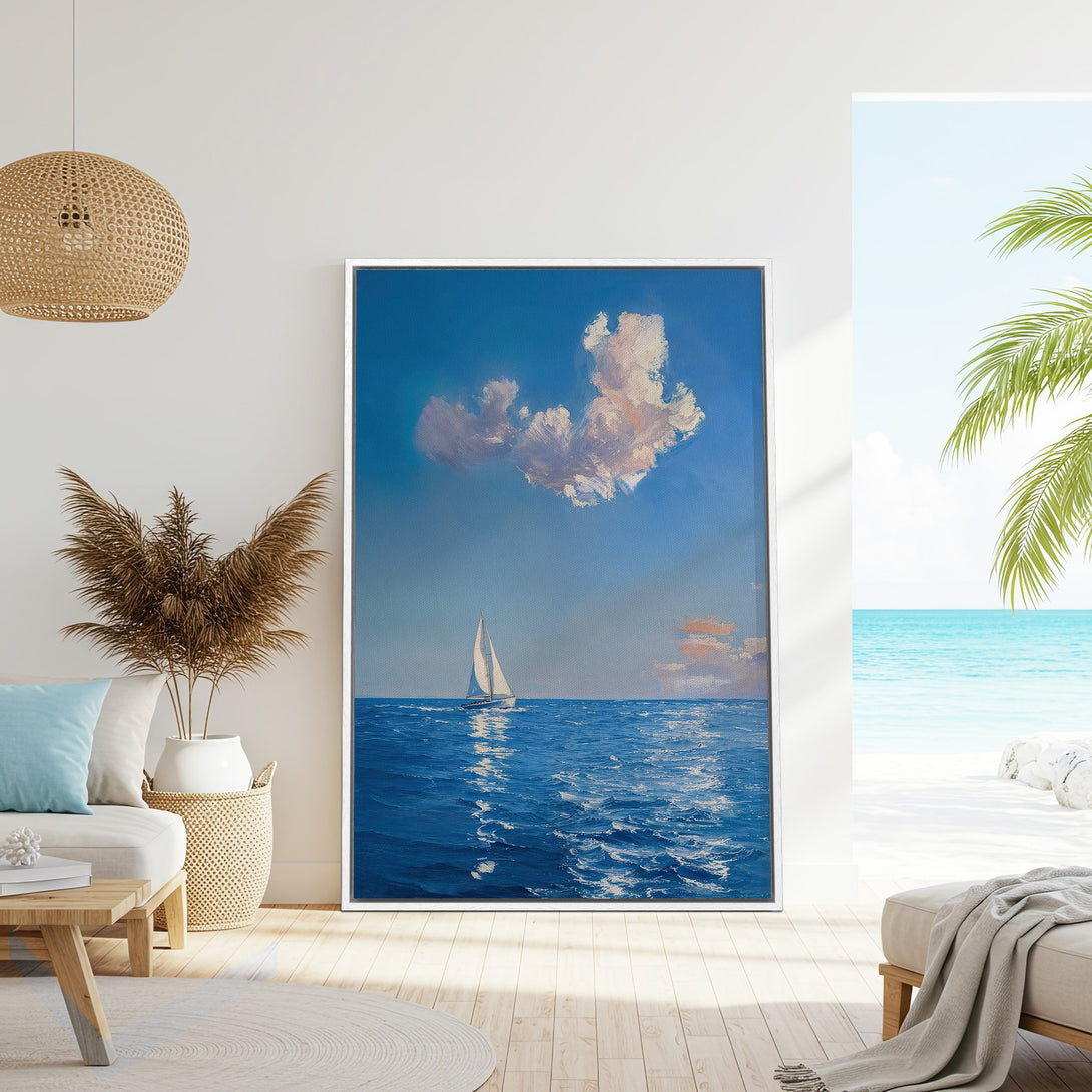 Framed Wall Art: Serene seascape Canvas Print with sailboat, blue ocean, and sky. Coastal style art in a calming blue and white palette. Perfect for any room!