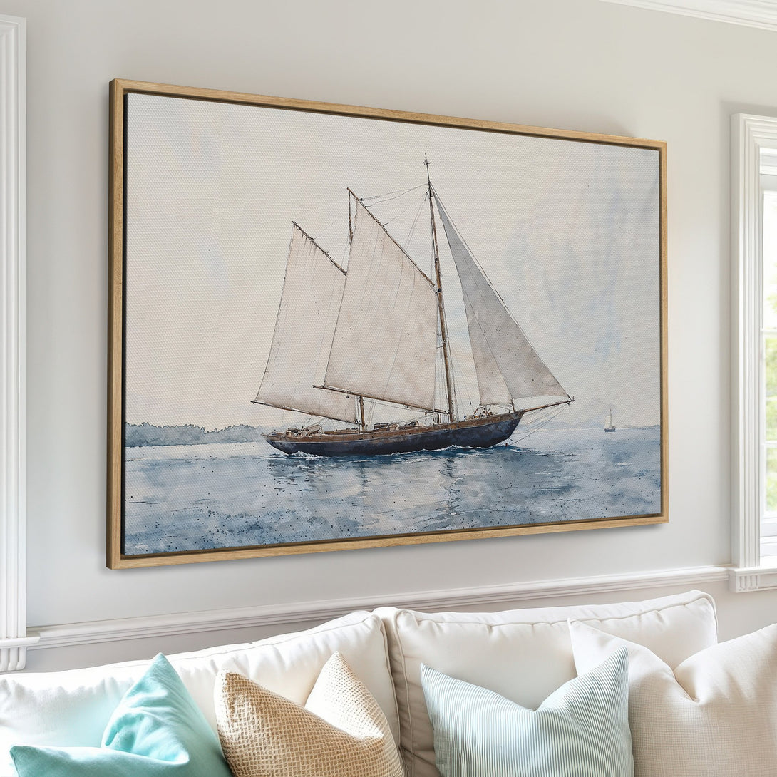 Framed Wall Art: Watercolor sailboat print in serene blue and neutral tones. Coastal decor for a calming living room.