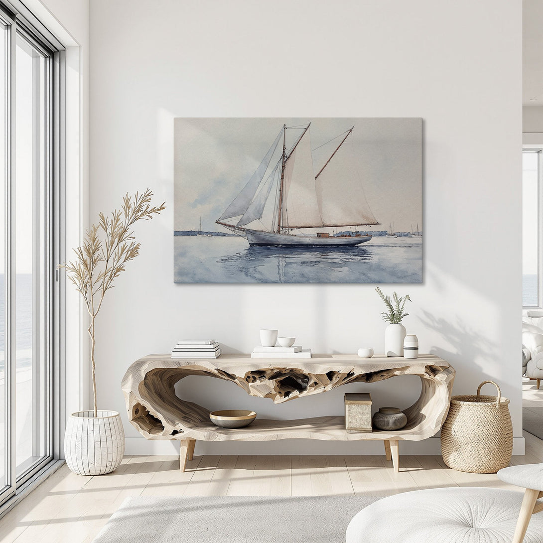 Framed Wall Art: Watercolor sailboat print in a coastal interior. Soft blue, white, and beige color palette. Perfect nautical decor for your home.