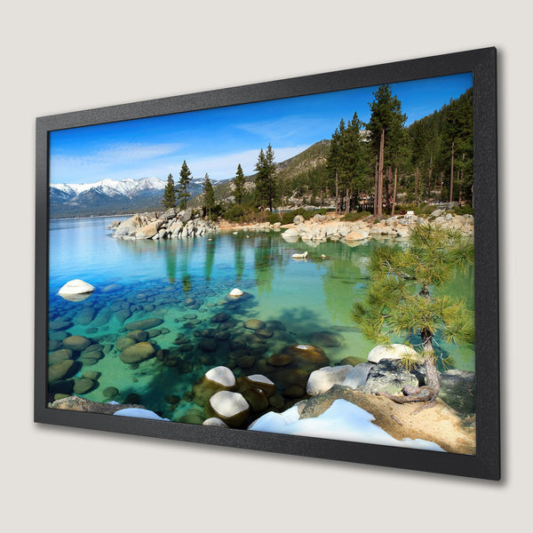 Framed Poster of serene lake landscape with blue, green, and white hues. Bring nature's beauty home!