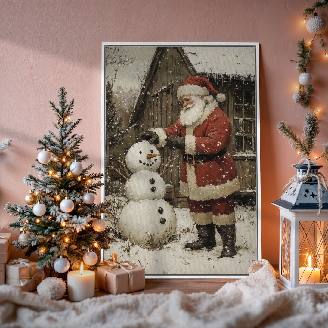 Framed Wall Art: Vintage Santa Claus building a snowman. Rustic style with warm red, white, and neutral tones. Perfect Christmas decor.