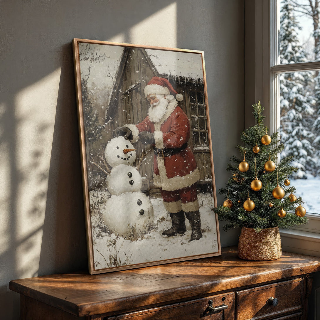 Framed Wall Art: Vintage Santa Claus building a snowman in a snowy scene, warm red & neutral color palette. Perfect Christmas decor.