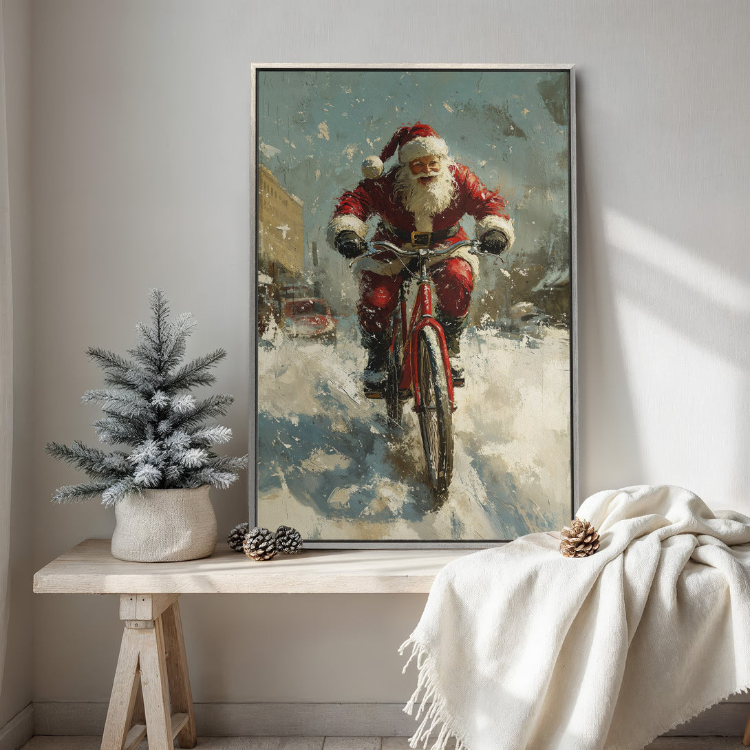 Framed Wall Art: Santa Claus on a bike in a snowy scene. Impressionistic style with red, blue, and white color palette, perfect for Christmas decor.