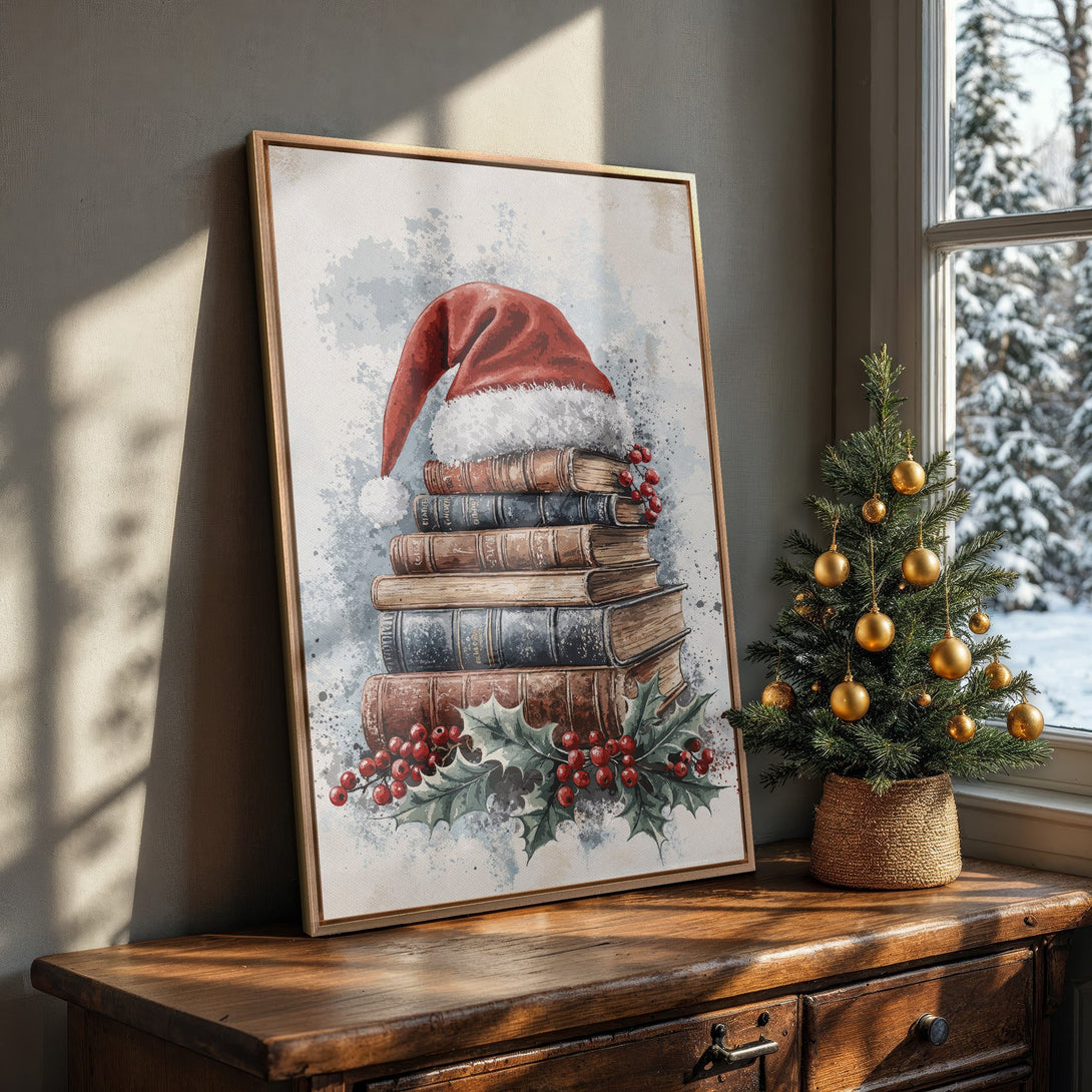 Framed Wall Art: Watercolor Christmas print with Santa hat on books. Festive red, green, and blue tones perfect for holiday decor. Shop now!