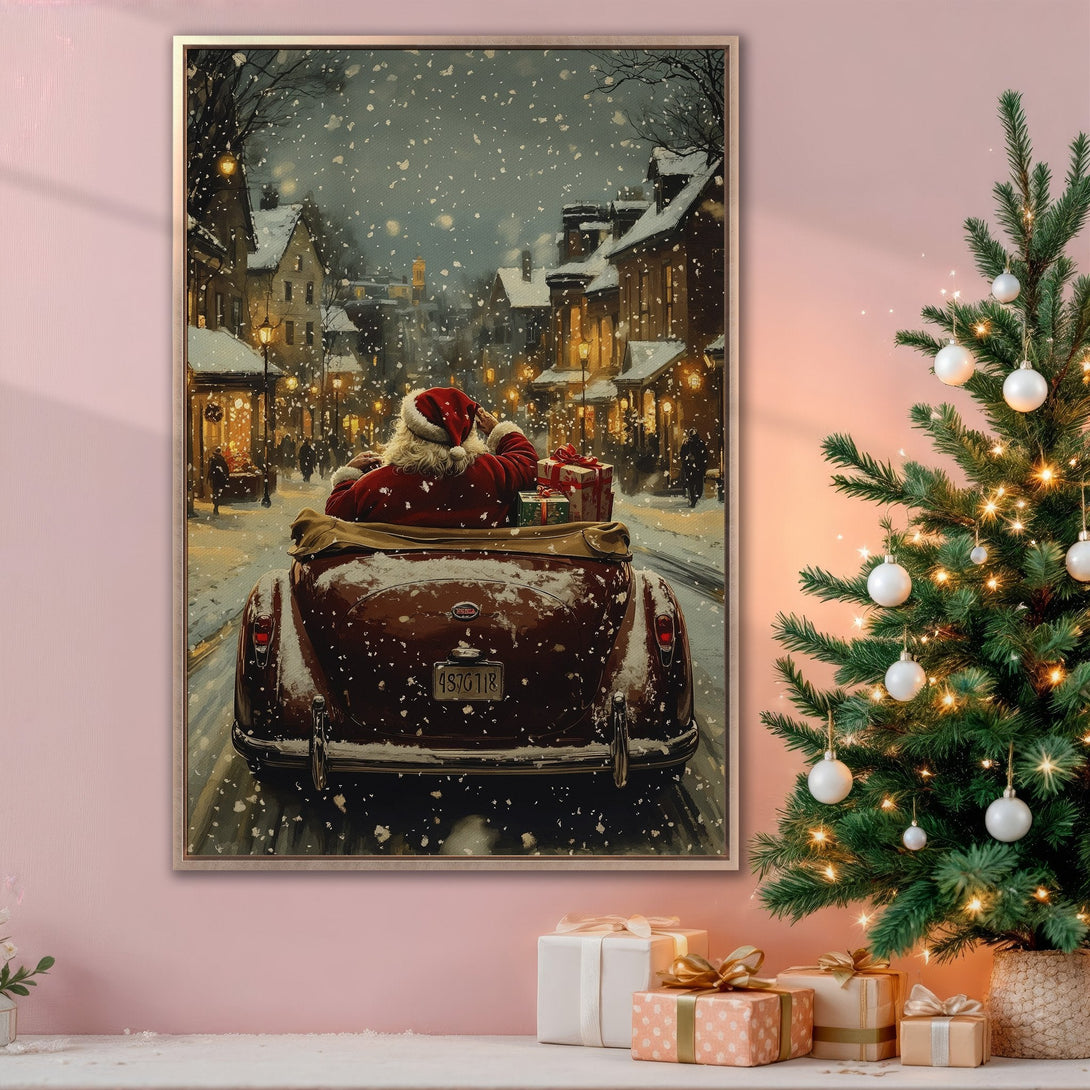 Framed Wall Art featuring Santa in a vintage car driving through a snowy town. Warm, inviting color palette perfect for Christmas decor.