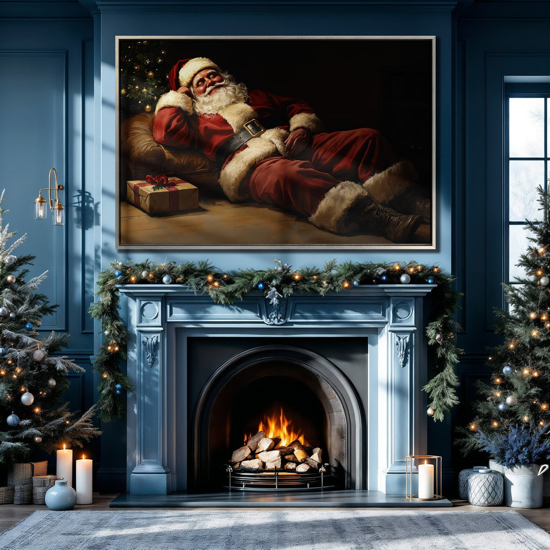 Framed Wall Art of Santa Claus relaxing by a fireplace, warm red and brown tones against a blue interior, perfect for holiday decor.