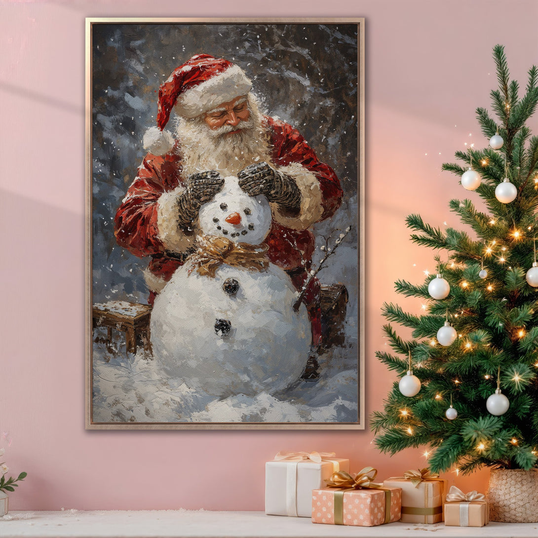 Framed Wall Art: Santa building a snowman in a painterly style. Warm red, white, and neutral tones create a cozy Christmas scene. Perfect holiday decor!