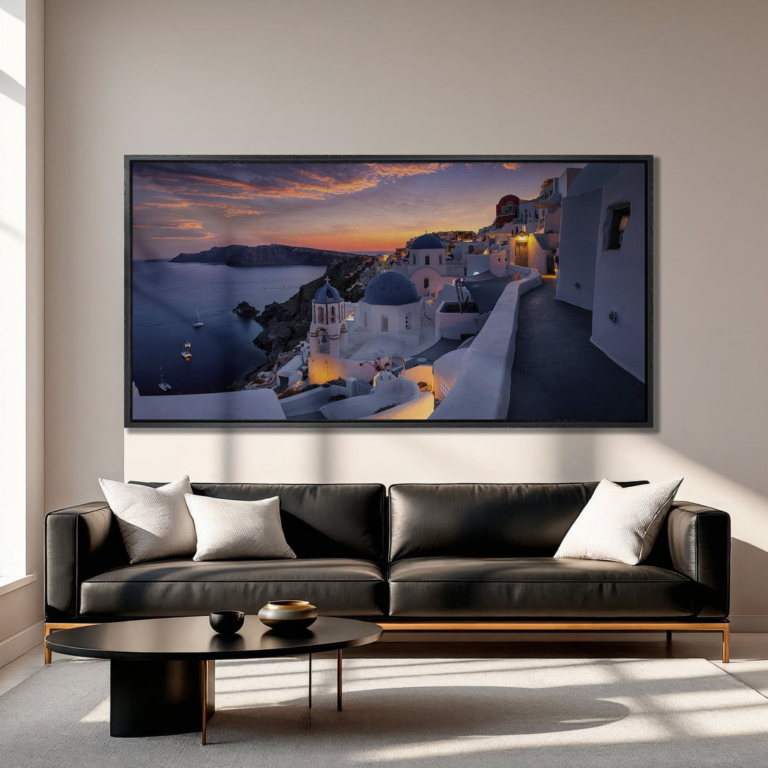 Framed Wall Art of Santorini sunset. Stunning Canvas Print featuring iconic white buildings, blue domes, and vibrant orange sky. Perfect for home decor!