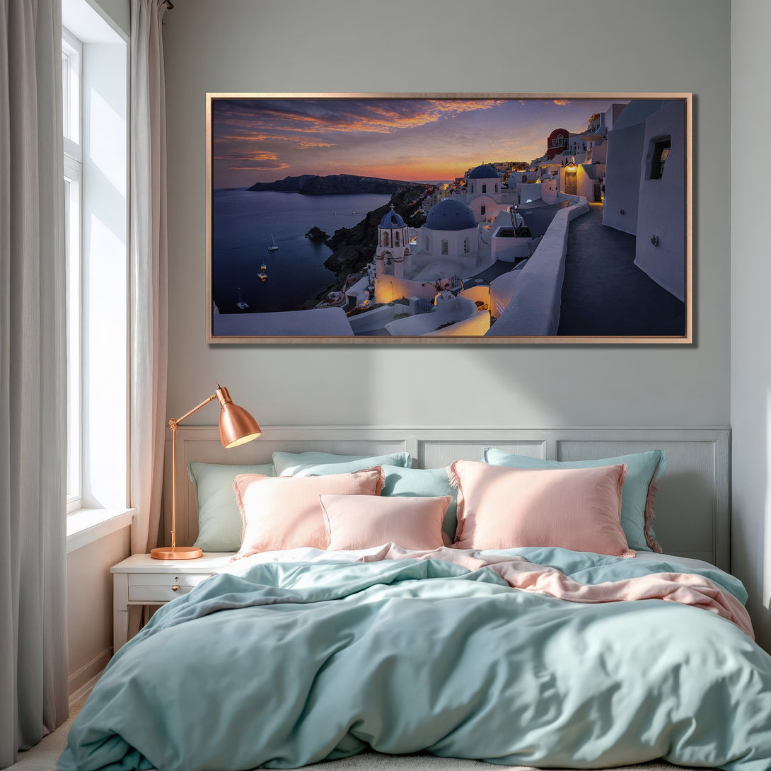 Framed Wall Art of Santorini sunset. Coastal style with blue, white, and sunset hues. Enhance your bedroom decor with this stunning canvas print.