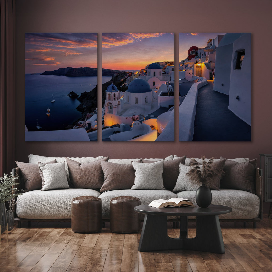 Canvas Print of Santorini sunset. Coastal landscape art with white buildings, blue domes, and warm sunset hues. Perfect wall decor for any room.
